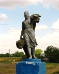 Sculpture of a woman with sheaves, Drabov