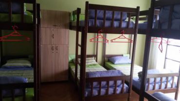 Кровать в общем номере смешанного типа с 16 кроватями  